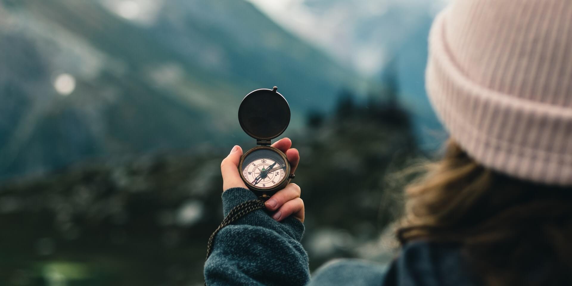 person navigating with a compass